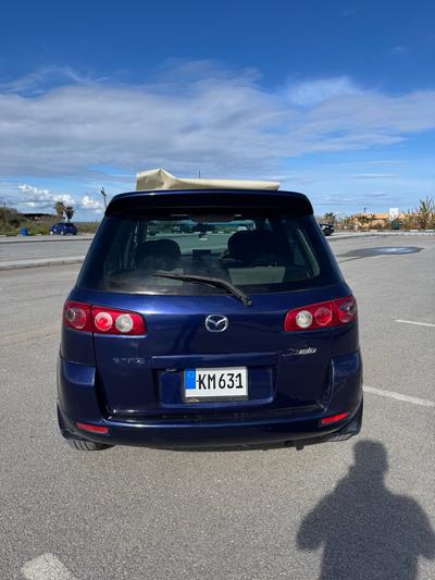 Mazda Demio — 4